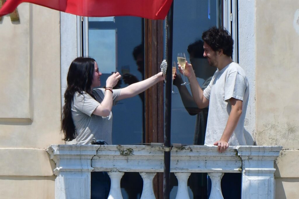 Billie Eilish, Nat Wolff, Hollywood romance, celebrity couple, Paris, balcony kiss, relationship confirmation, entertainment news, music, acting, love story